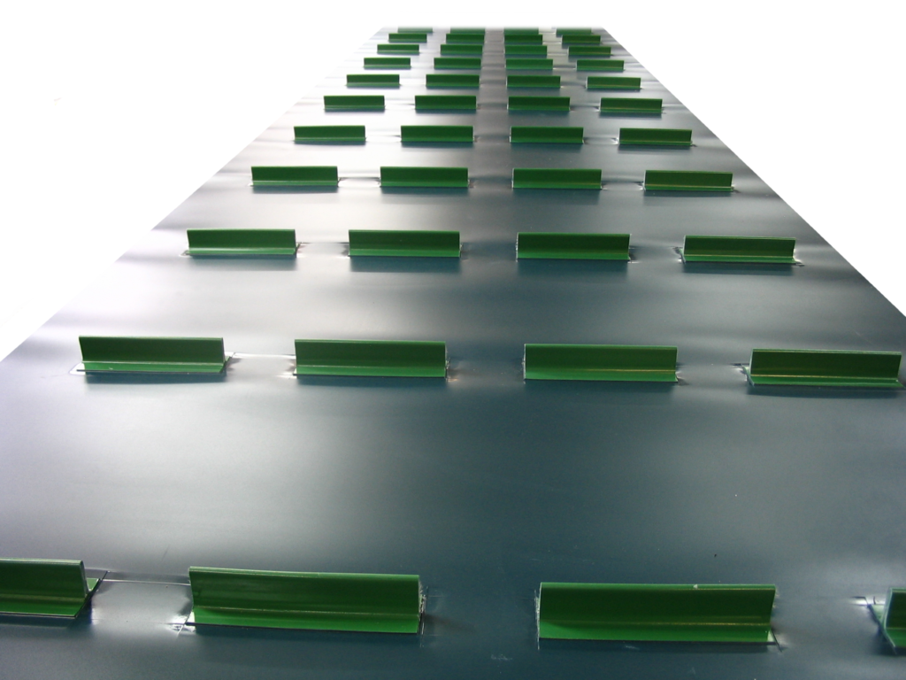 PCV PVC PU conveyor belts With guiding profiles, with side frills protecting the goods from spilling, with carriers enabling the transport of goods on inclined conveyors, with a structure that prevents the movement of goods, with surface perforation, for curved conveyors